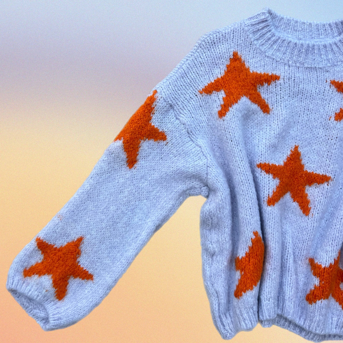 Pull RORY stelle lilla/arancio