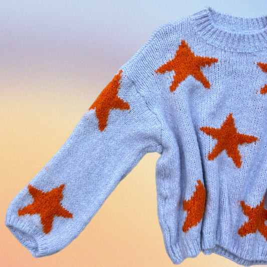 Pull RORY stelle lilla/arancio